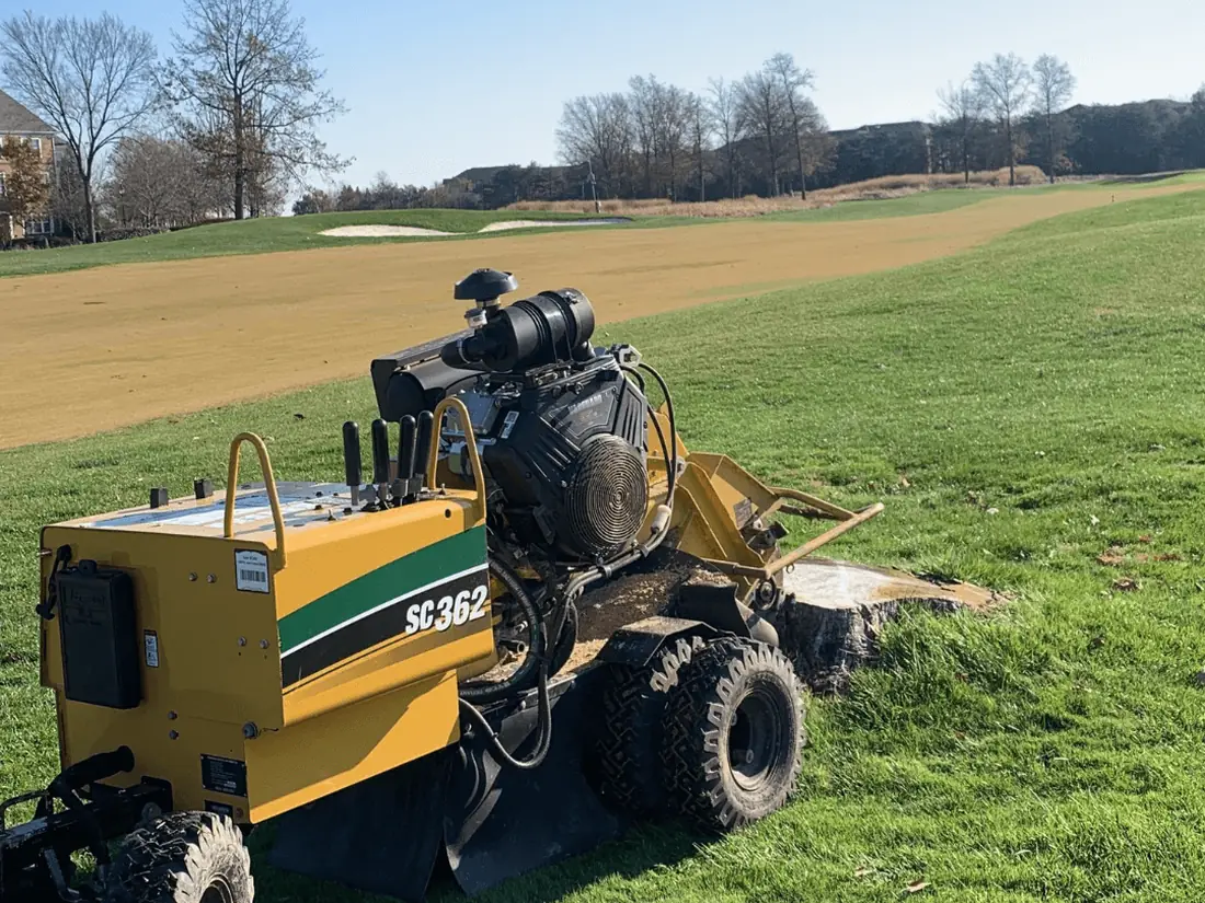 Stump grinder on a large open lawn